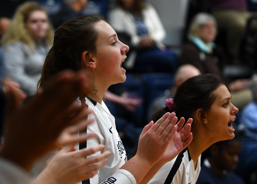 Columbia College volleyball players Camryn Schear and Raven Buckley cheer for their team